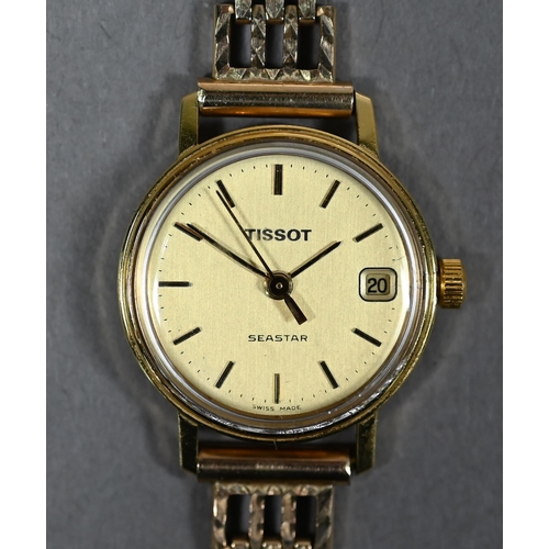 394 - A lady's 18ct gold Tissot Seastar wristwatch, the 18mm champagne dial with date aperture, on 9ct gol... 