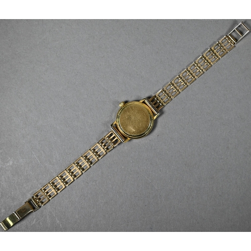 394 - A lady's 18ct gold Tissot Seastar wristwatch, the 18mm champagne dial with date aperture, on 9ct gol... 