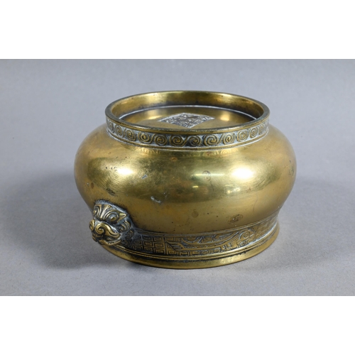 401 - A 19th century Chinese bronze censer or incense burner of compressed globular form with cast taotie ... 