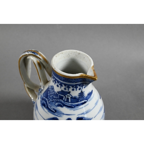 407 - An 18th century Chinese export blue and white sparrow-beak jug and cover with moulded pomegranate fi... 