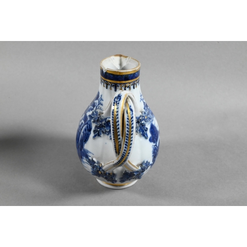 407 - An 18th century Chinese export blue and white sparrow-beak jug and cover with moulded pomegranate fi... 