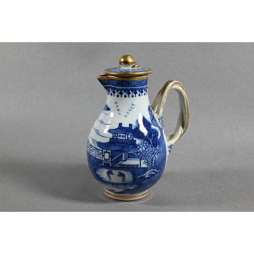 407 - An 18th century Chinese export blue and white sparrow-beak jug and cover with moulded pomegranate fi... 