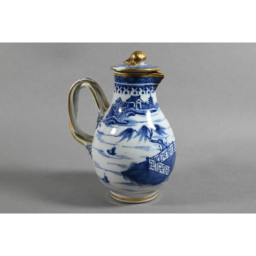 407 - An 18th century Chinese export blue and white sparrow-beak jug and cover with moulded pomegranate fi... 