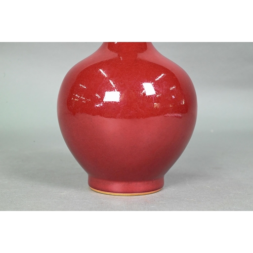 419 - A Chinese copper red langyao monochrome bottle vase in the 18th century manner, the exterior evenly ... 