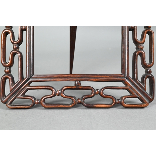 423 - A 20th century Chinese pierced hardwood frame with carved 'shou' symbol and strut stand, 30 cm high ... 