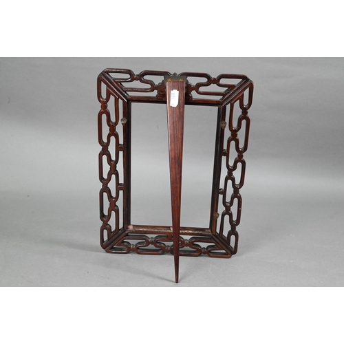 423 - A 20th century Chinese pierced hardwood frame with carved 'shou' symbol and strut stand, 30 cm high ... 