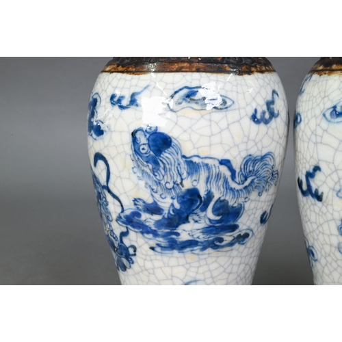 427 - A pair of late 19th century Chinese blue and white Nanjing export baluster vases, Qing dynasty, pain... 