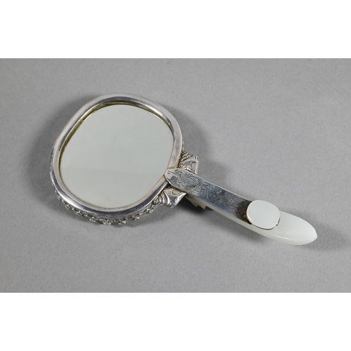 430 - A 19th century Chinese white jade and white metal mounted hand mirror, Qing dynasty, with cloud shap... 