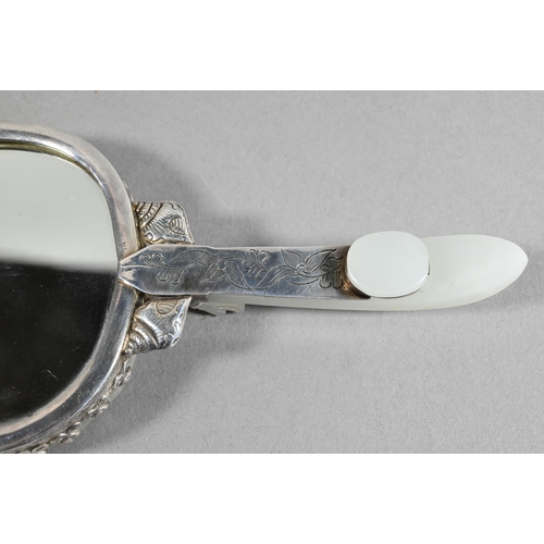 430 - A 19th century Chinese white jade and white metal mounted hand mirror, Qing dynasty, with cloud shap... 