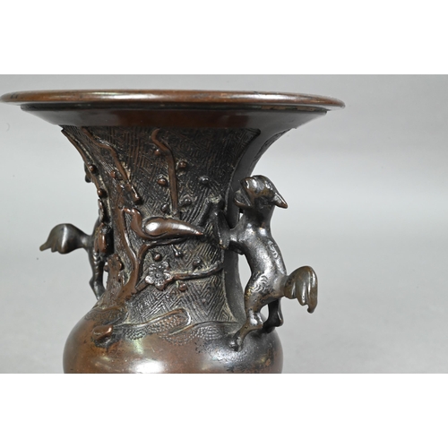 434 - Four late 19th or early 20th century Japanese bronzes comprising a small baluster vase with flared n... 