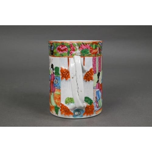 440 - A late 19th century Chinese famille rose tankard entwinned strap handle, the exterior painted in pol... 