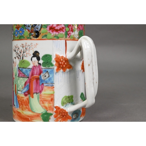 440 - A late 19th century Chinese famille rose tankard entwinned strap handle, the exterior painted in pol... 