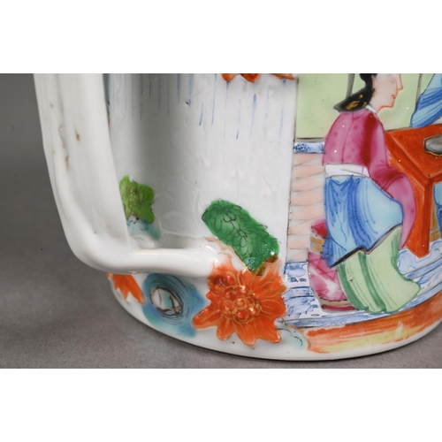 440 - A late 19th century Chinese famille rose tankard entwinned strap handle, the exterior painted in pol... 