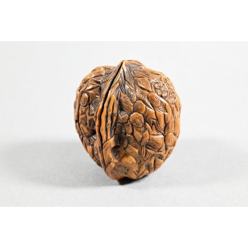 451 - Four Chinese carved fruit pit or fruit stone items, Guangdong province, including two boat carvings ... 