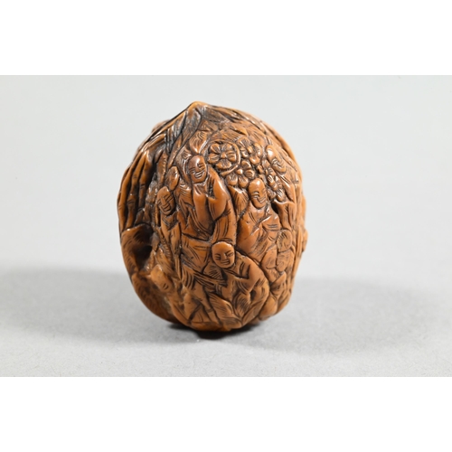 451 - Four Chinese carved fruit pit or fruit stone items, Guangdong province, including two boat carvings ... 