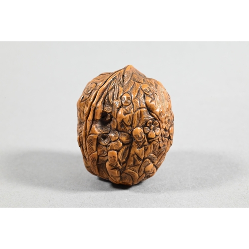 451 - Four Chinese carved fruit pit or fruit stone items, Guangdong province, including two boat carvings ... 