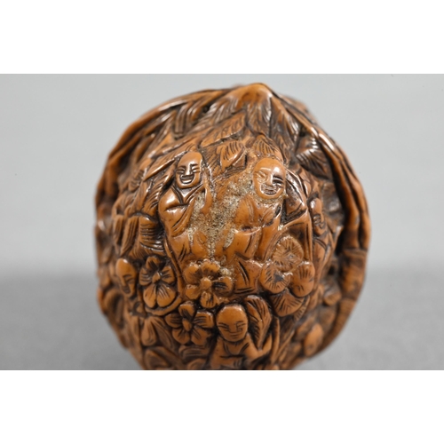 451 - Four Chinese carved fruit pit or fruit stone items, Guangdong province, including two boat carvings ... 