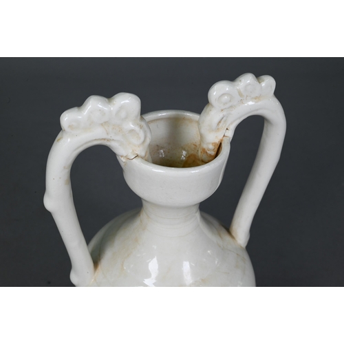 452 - A Chinese Tang style white glazed 'amphora' vase, the looping handles with dragon head terminals bit... 