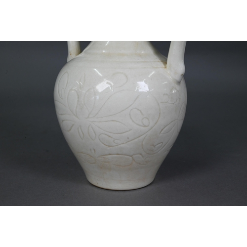 452 - A Chinese Tang style white glazed 'amphora' vase, the looping handles with dragon head terminals bit... 