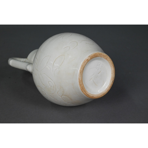 452 - A Chinese Tang style white glazed 'amphora' vase, the looping handles with dragon head terminals bit... 