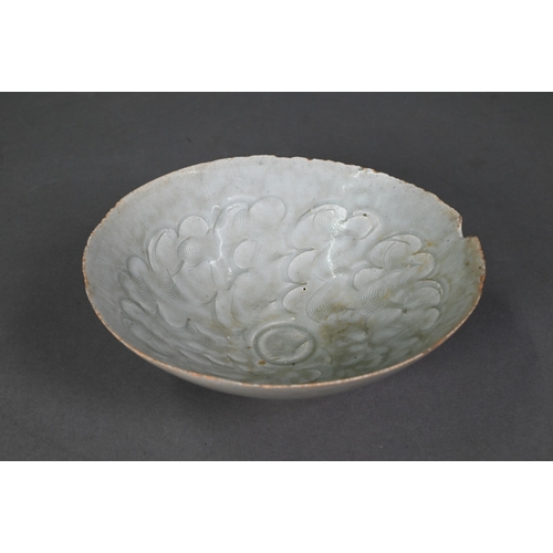 453 - A Chinese Qingbai bowl, Song Dynasty (960-1279) with incised cloud motif design under the pale celad... 