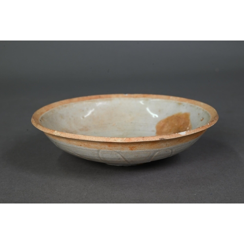 454 - A Chinese Qingbai shallow bowl, Song Dynasty, the exterior with incised lotus decoration and plain i... 