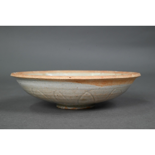 454 - A Chinese Qingbai shallow bowl, Song Dynasty, the exterior with incised lotus decoration and plain i... 