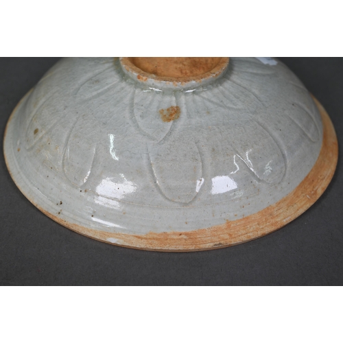 454 - A Chinese Qingbai shallow bowl, Song Dynasty, the exterior with incised lotus decoration and plain i... 