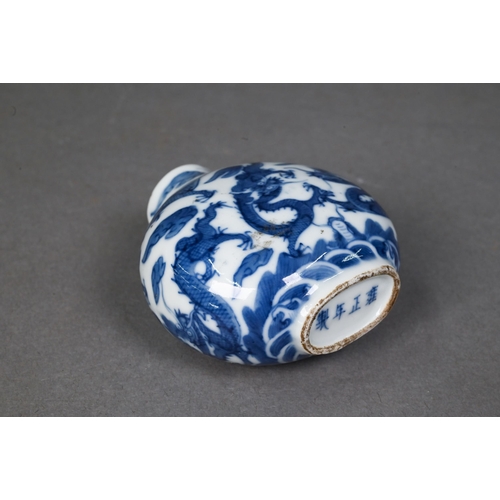 467 - A Chinese blue and white 'dragon' snuff bottle, the flattened oval body painted in underglaze blue w... 