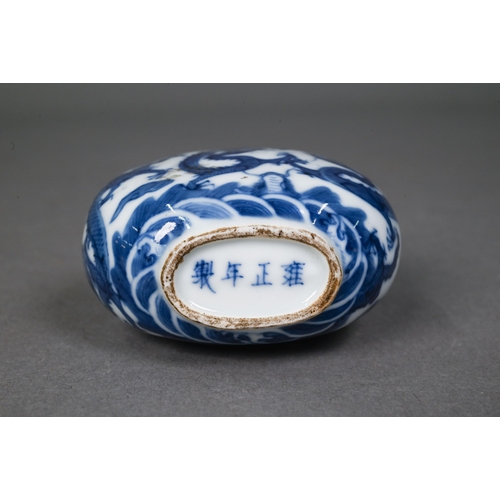 467 - A Chinese blue and white 'dragon' snuff bottle, the flattened oval body painted in underglaze blue w... 