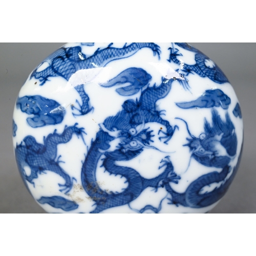 467 - A Chinese blue and white 'dragon' snuff bottle, the flattened oval body painted in underglaze blue w... 