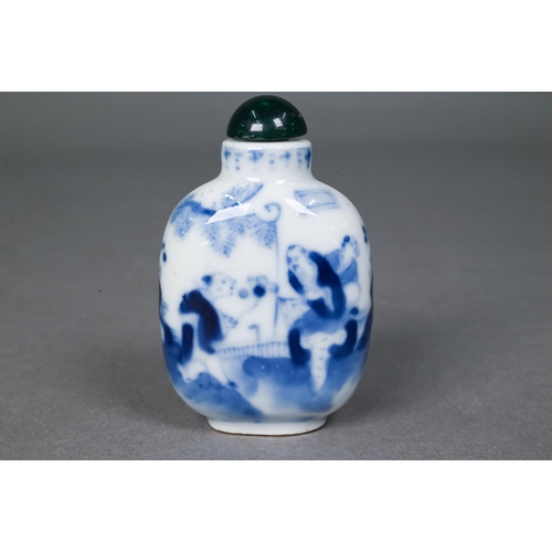 467 - A Chinese blue and white 'dragon' snuff bottle, the flattened oval body painted in underglaze blue w... 