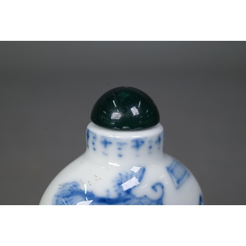 467 - A Chinese blue and white 'dragon' snuff bottle, the flattened oval body painted in underglaze blue w... 