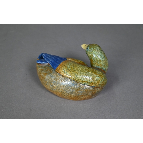 470 - A pair of 18th century Chinese recumbent ducks, the well modelled naturalistic figures with their he... 