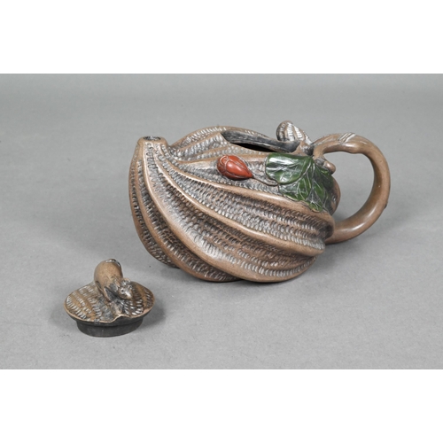 474 - A Chinese naturalistic Yixing teapot and cover with mouse finial and looping vine handle, the body a... 