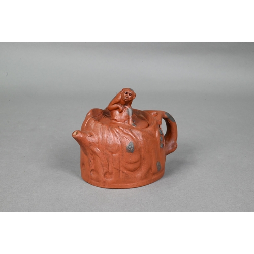 476 - A Chinese Yixing gloular lotus leaf teapot and cover with frog finial 18 cm w x 10 cm h to/w another... 