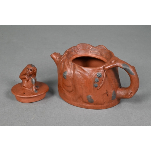 476 - A Chinese Yixing gloular lotus leaf teapot and cover with frog finial 18 cm w x 10 cm h to/w another... 