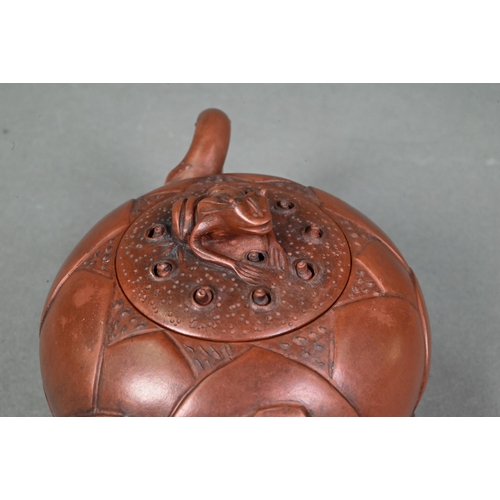 476 - A Chinese Yixing gloular lotus leaf teapot and cover with frog finial 18 cm w x 10 cm h to/w another... 