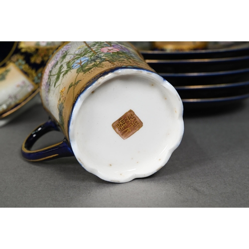 481 - An early 20th century Japanese Satsuma part coffee service gilded and painted with Fuji landscapes a... 