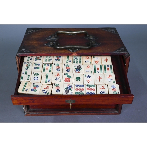 482 - A Chinese Mah Jong set, the hardwood brass mounted case having two brass handles and sliding front p... 