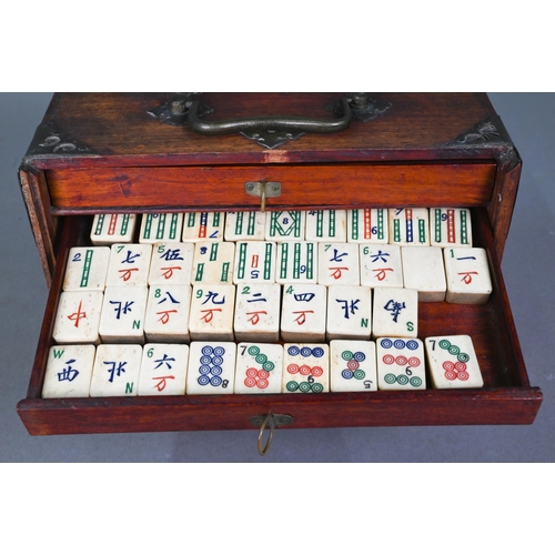 482 - A Chinese Mah Jong set, the hardwood brass mounted case having two brass handles and sliding front p... 