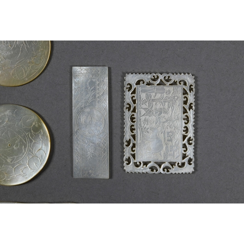 484 - A collection of 18th and 19th century Chinese mother-of-pearl gaming counters including a mounted ar... 