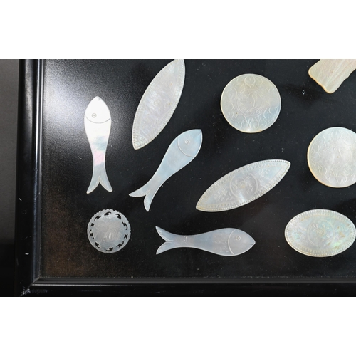 484 - A collection of 18th and 19th century Chinese mother-of-pearl gaming counters including a mounted ar... 