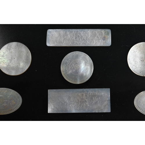 484 - A collection of 18th and 19th century Chinese mother-of-pearl gaming counters including a mounted ar... 