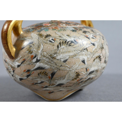 485 - A small Satsuma twin-handled koro and cover with chrysanthemum finial,  gilded and finely painted in... 