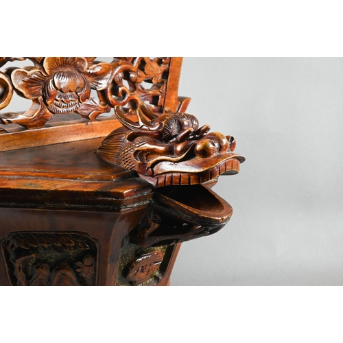 488 - A Chinese stained hardwood water bucket of tapering octagonal form with floral and foliate fret-cut ... 