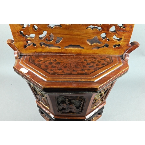 488 - A Chinese stained hardwood water bucket of tapering octagonal form with floral and foliate fret-cut ... 