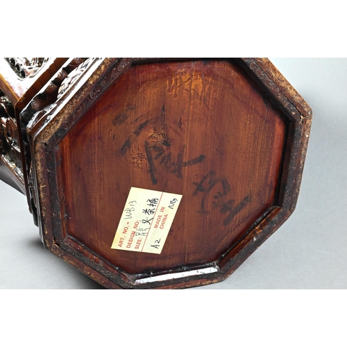 488 - A Chinese stained hardwood water bucket of tapering octagonal form with floral and foliate fret-cut ... 