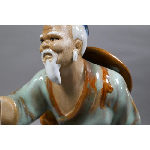 489 - Four 20th century Chinese Shiwan lead-glazed mudmen figures, signed 'Wan Jiang' and three other simi... 