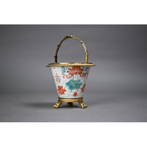 490 - A 19th century Chinese tea bowl of tapering form painted with flowering lotus in red and green ename... 